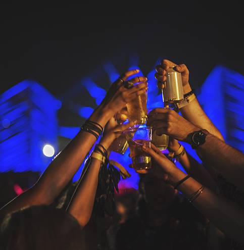 Group of Friends Drinking Beers Enjoying Music Festival together